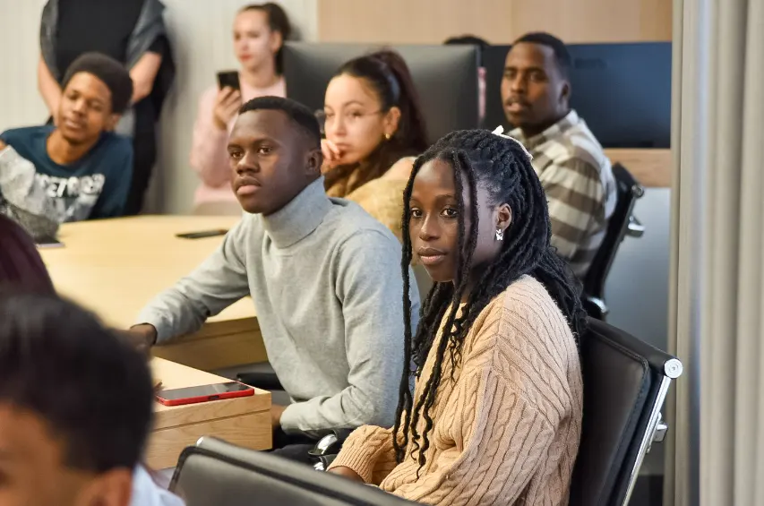 Employee making a comment during a Town Hall staff meeting.